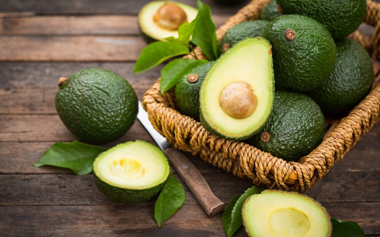 fresh-organic-avocado-on-the-wooden-table-picture-id1143742213